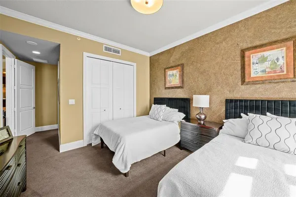 a bedroom with bed and a couch