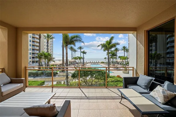 a view of a chairs and table in a patio