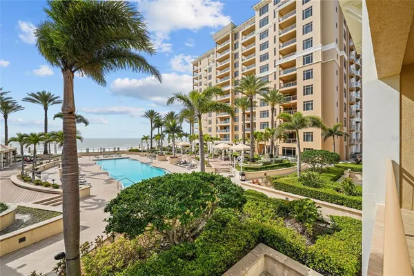 view of swimming pool with outdoor seating and plants