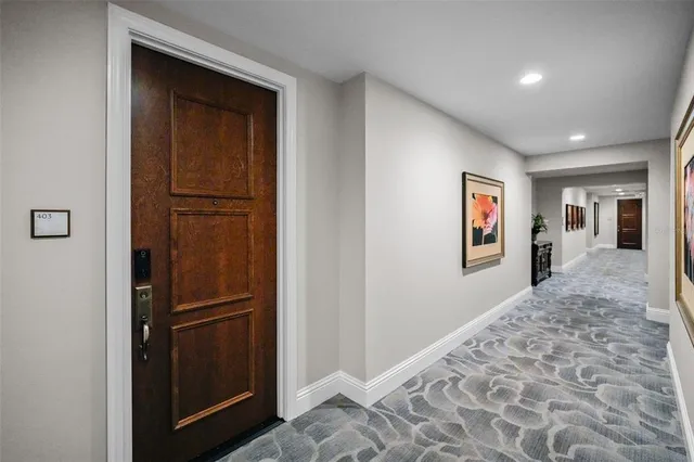 a view of hallway with wooden floor