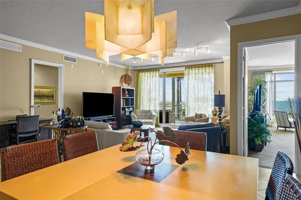 a view of a dining room with furniture window and outside view