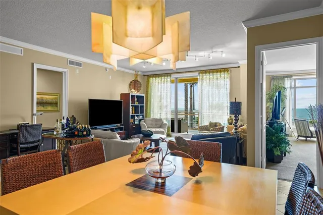 a view of a dining room with furniture window and outside view