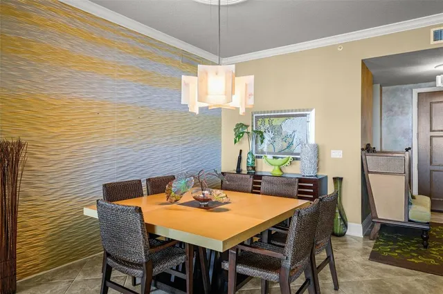 a view of a dining room with furniture and window