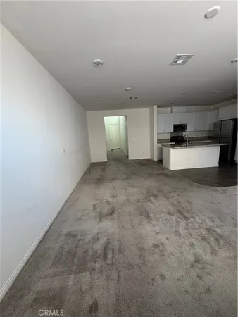 a view of a kitchen with a sink and cabinets