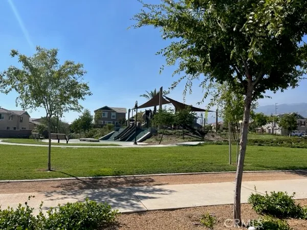 a view of a chairs and table in patio