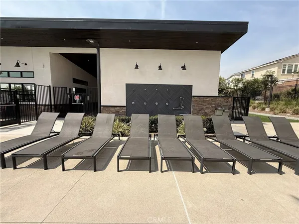 a view of a swimming pool with lounge chair
