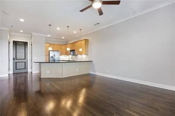 a view of a kitchen with a sink and a window