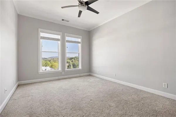 an empty room with windows and yard