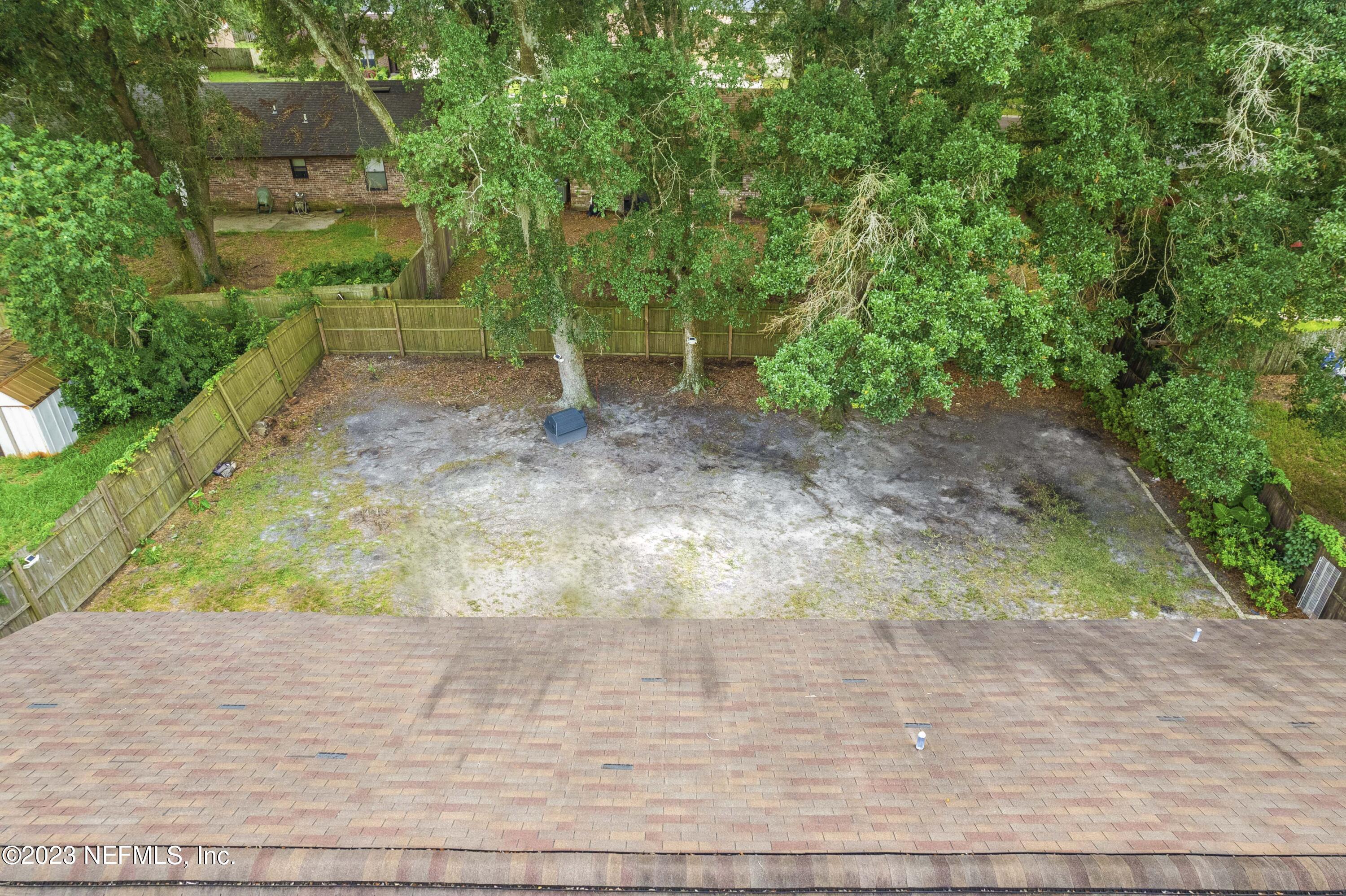7952 Gulf Road South Jacksonville, FL 32244 - Photo 11 of 14 a view of a pathway both side of yard