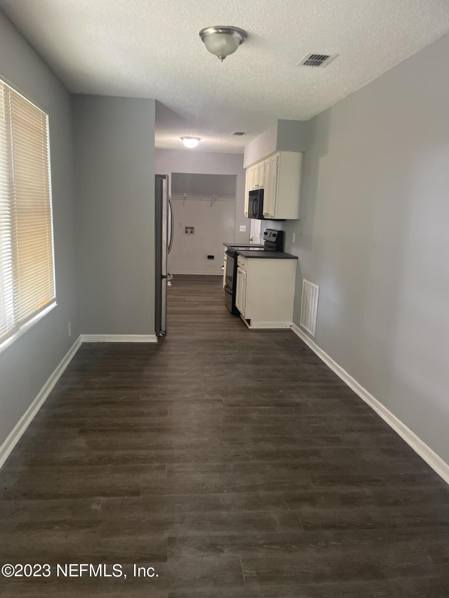 7952 Gulf Road South Jacksonville, FL 32244 - Photo 3 of 14 a view of kitchen with wooden floor