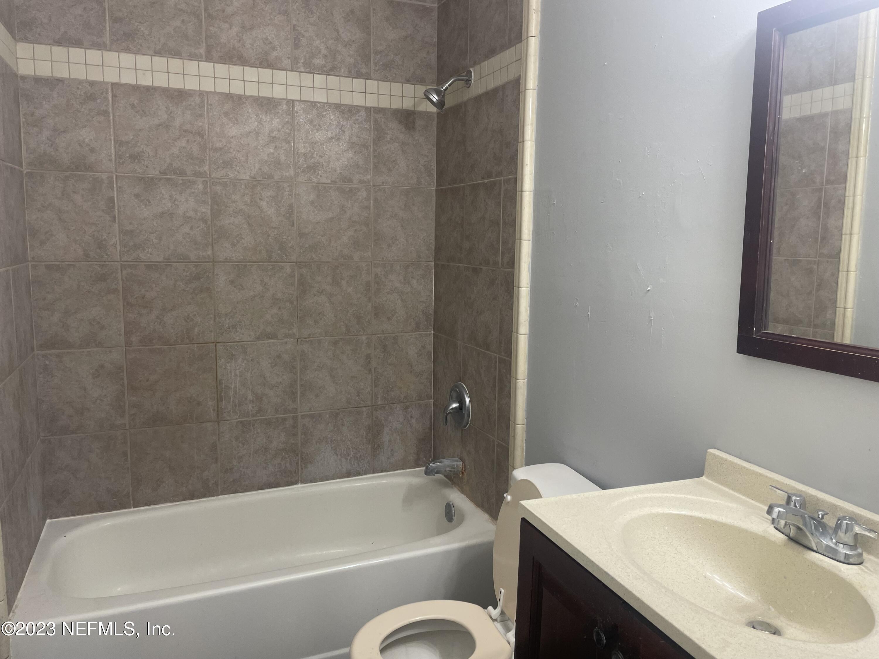 7952 Gulf Road South Jacksonville, FL 32244 - Photo 7 of 14 a bathroom with a sink and a bathtub