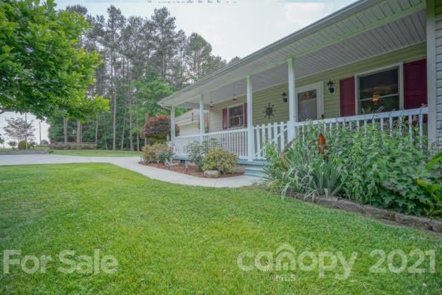9675 Mt Olive Road Mount Pleasant, NC 28124 - Photo 2 of 48 a front view of a house with a garden