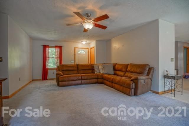 9675 Mt Olive Road Mount Pleasant, NC 28124 - Photo 13 of 48 a living room with furniture and a ceiling fan