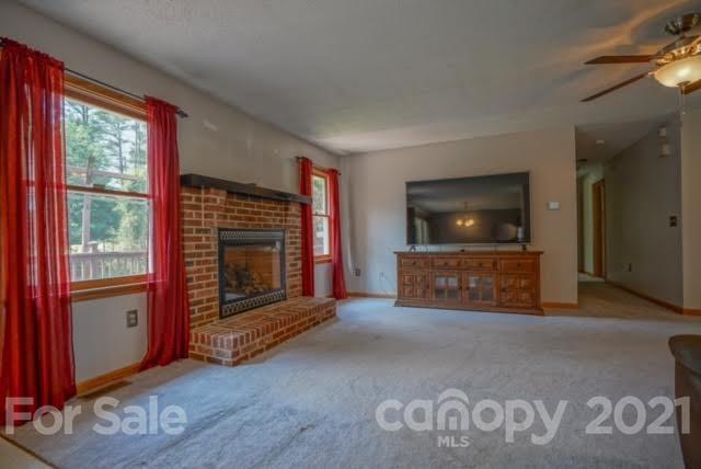 9675 Mt Olive Road Mount Pleasant, NC 28124 - Photo 14 of 48 a living room with furniture and a flat screen tv