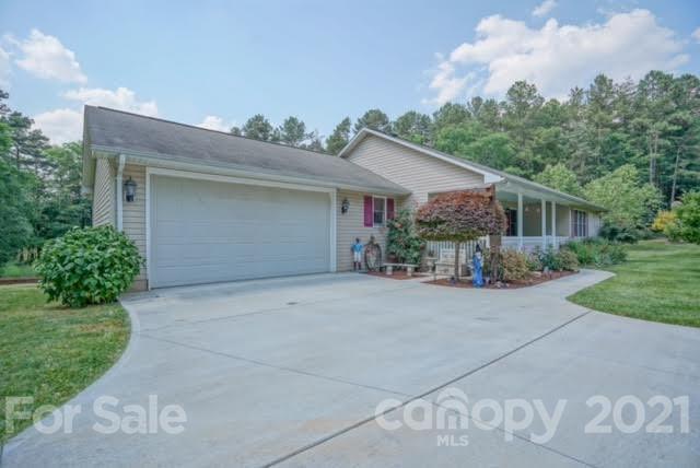 9675 Mt Olive Road Mount Pleasant, NC 28124 - Photo 3 of 48 a view of a house with a yard and garage