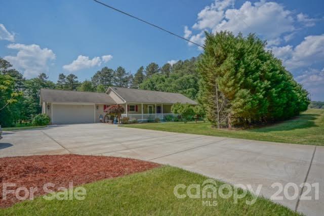 9675 Mt Olive Road Mount Pleasant, NC 28124 - Photo 4 of 48 a front view of a house with a yard and garage