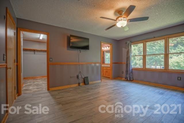 9675 Mt Olive Road Mount Pleasant, NC 28124 - Photo 31 of 48 wooden floor and windows in a room