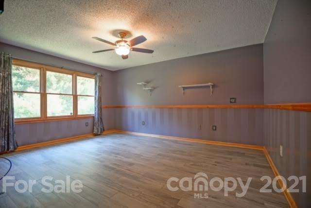 9675 Mt Olive Road Mount Pleasant, NC 28124 - Photo 32 of 48 wooden floor in an empty room with a window