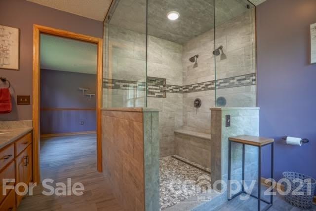 9675 Mt Olive Road Mount Pleasant, NC 28124 - Photo 34 of 48 a bathroom with a glass shower door and a sink