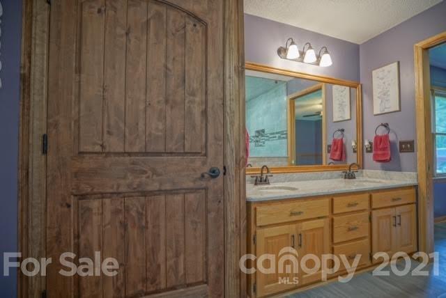 9675 Mt Olive Road Mount Pleasant, NC 28124 - Photo 36 of 48 a bathroom with a sink and a mirror