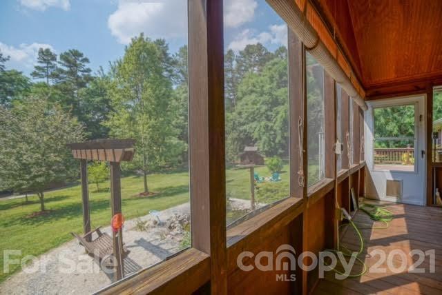 9675 Mt Olive Road Mount Pleasant, NC 28124 - Photo 40 of 48 a view of a porch with furniture and garden