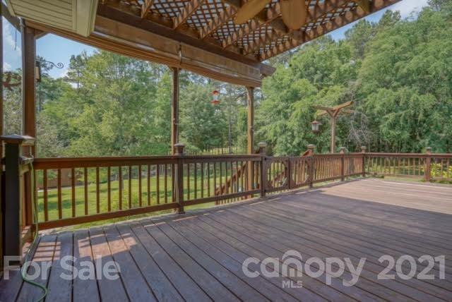 9675 Mt Olive Road Mount Pleasant, NC 28124 - Photo 44 of 48 a balcony with wooden floor