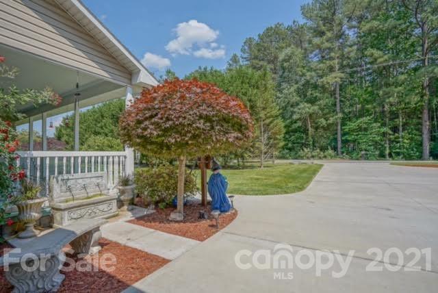 9675 Mt Olive Road Mount Pleasant, NC 28124 - Photo 8 of 48 a view of a porch with a yard