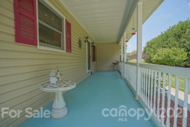 9675 Mt Olive Road Mount Pleasant, NC 28124 - Photo 9 of 48 a view of a porch with seating space