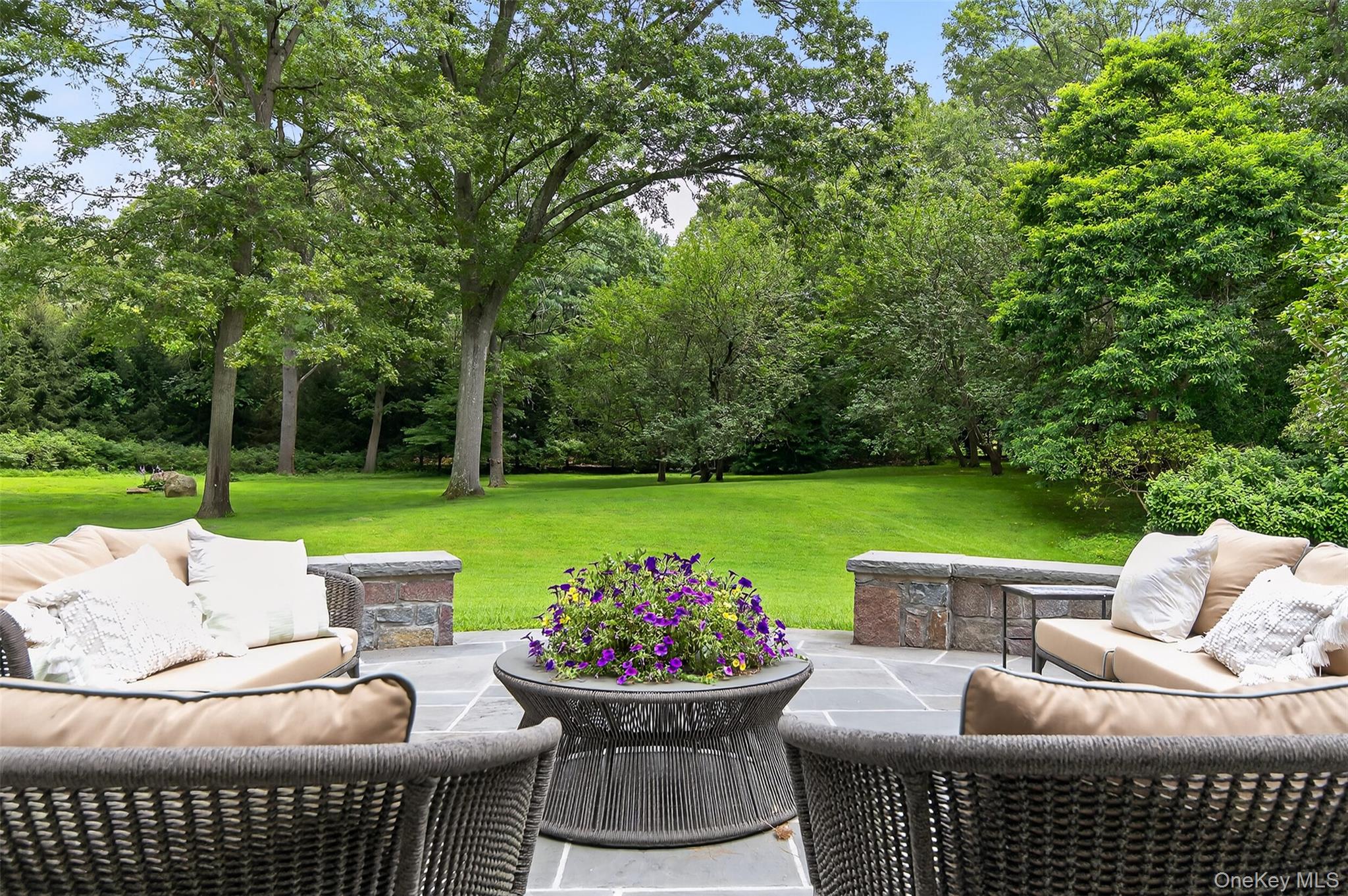 343 Chicken Valley Road Glen Head, NY 11545 - Photo 23 of 49 a view of a patio with couches potted plants and a big yard
