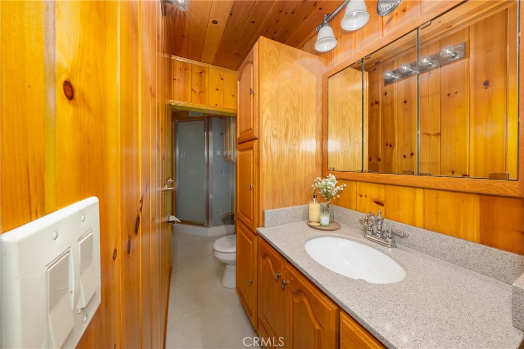54805 South South Circle Idyllwild, CA 92549 - Photo 14 of 32 a bathroom with a double vanity sink and a mirror