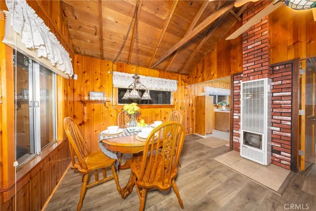 a view of a patio with table and chairs