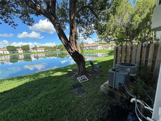 a view of a garden with an tree