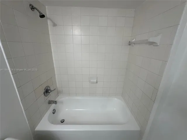 a white bath tub sitting in a bathroom