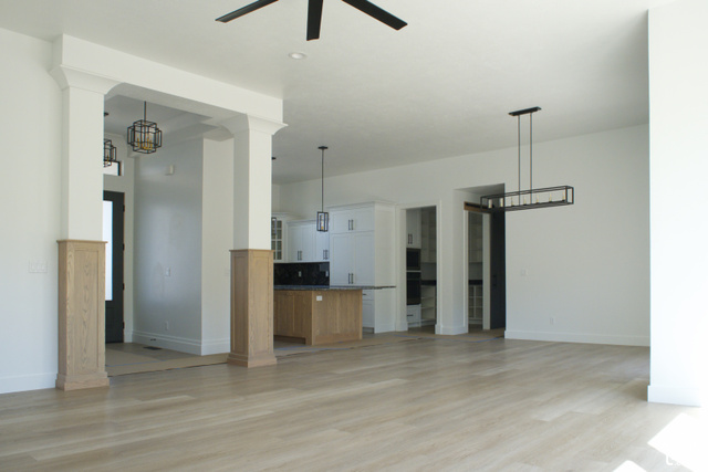 3504 North Sun Dancer Loop Logan, UT 84341 - Photo 4 of 59 Light wood-finish flooring with white walls and trim