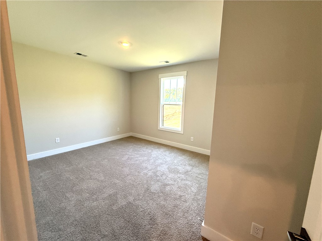 504 Tilman Court Anderson, SC 29621 - Photo 24 of 28 This inviting bedroom provides a comfortable and tranquil retreat.