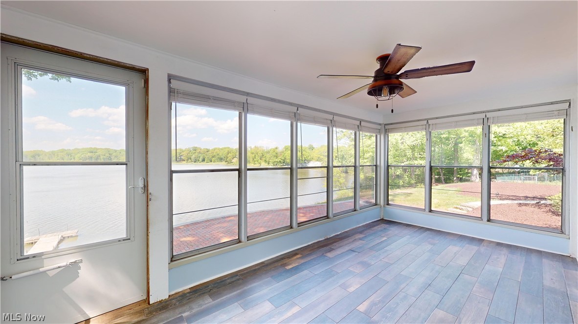 7421 Diagonal Road Kent, OH 44240 - Photo 22 of 48 sunroom with a water view, LTV flooring and ceiling fan