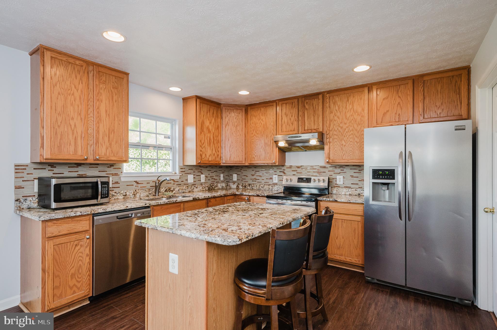 4614 Riddle Drive Nottingham, MD 21236 - Photo 15 of 54 Breakfast Bar & Stainless Steel Appliances