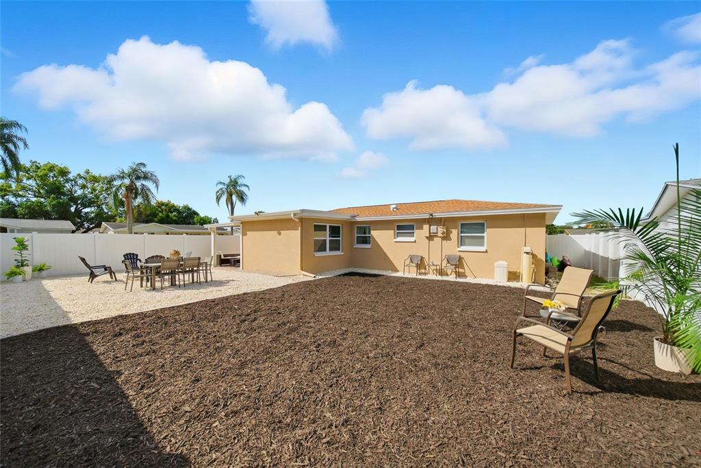 3744 Carron Street New Port Richey, FL 34652 - Photo 21 of 28 a view of a house with backyard and sitting area