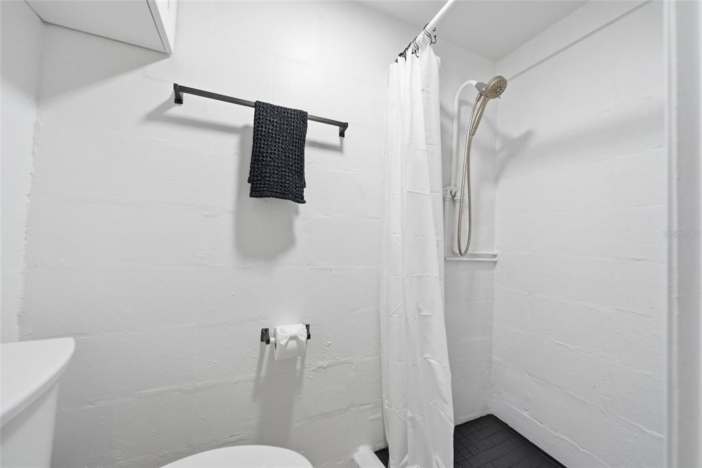 3744 Carron Street New Port Richey, FL 34652 - Photo 24 of 28 a bathroom with a shower and toilet