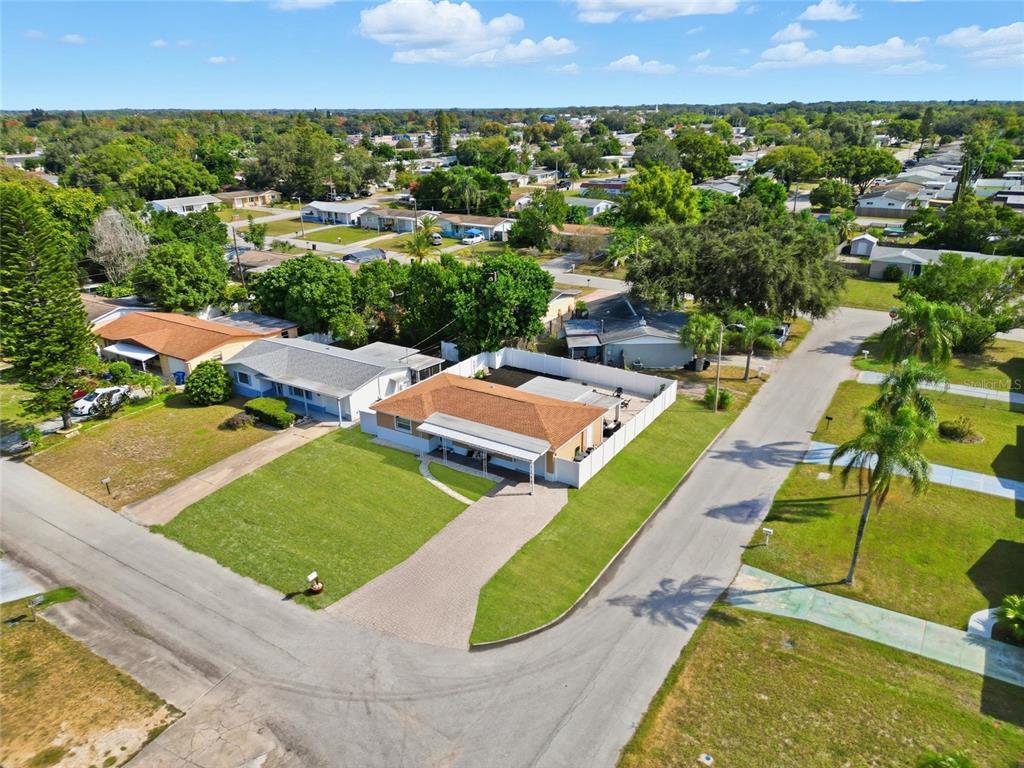 3744 Carron Street New Port Richey, FL 34652 - Photo 26 of 28 an aerial view of residential houses with outdoor space and swimming pool