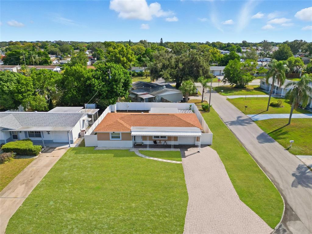 3744 Carron Street New Port Richey, FL 34652 - Photo 27 of 28 an aerial view of a house with swimming pool garden and patio