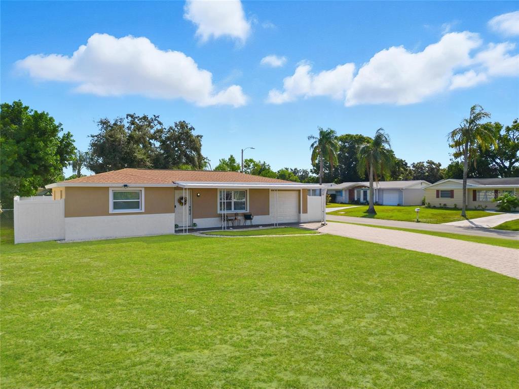 3744 Carron Street New Port Richey, FL 34652 - Photo 28 of 28 a view of a house with a big yard