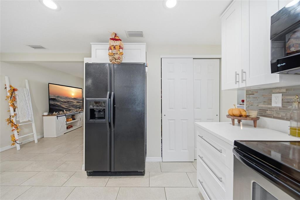 3744 Carron Street New Port Richey, FL 34652 - Photo 10 of 28 a kitchen with stainless steel appliances a refrigerator and a stove