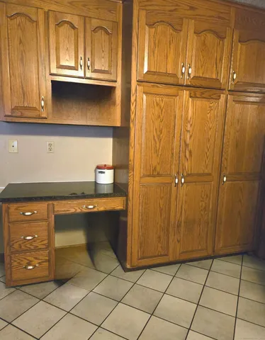 a view of a dining room with furniture and window