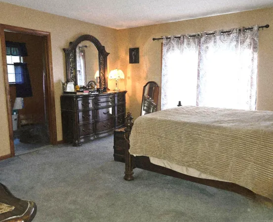 a view of bathroom with a sink and a mirror