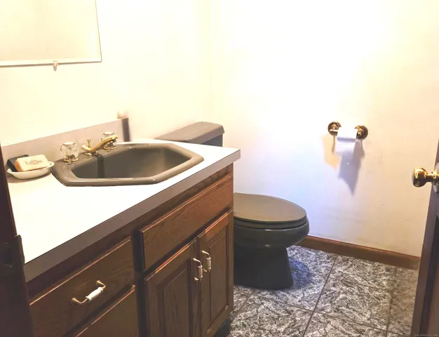 a bed sitting in a room next to a window