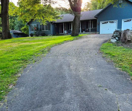 a front view of a house with a yard and porch