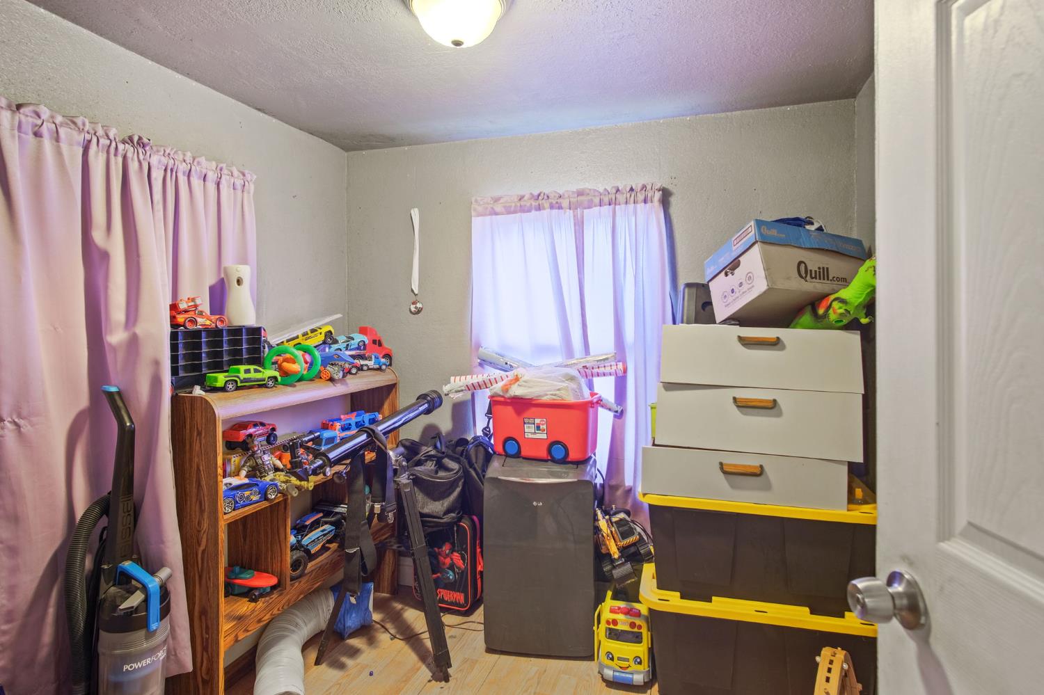 1225 Eugene Avenue Modesto, CA 95351 - Photo 12 of 39 a bedroom with a bed and a window