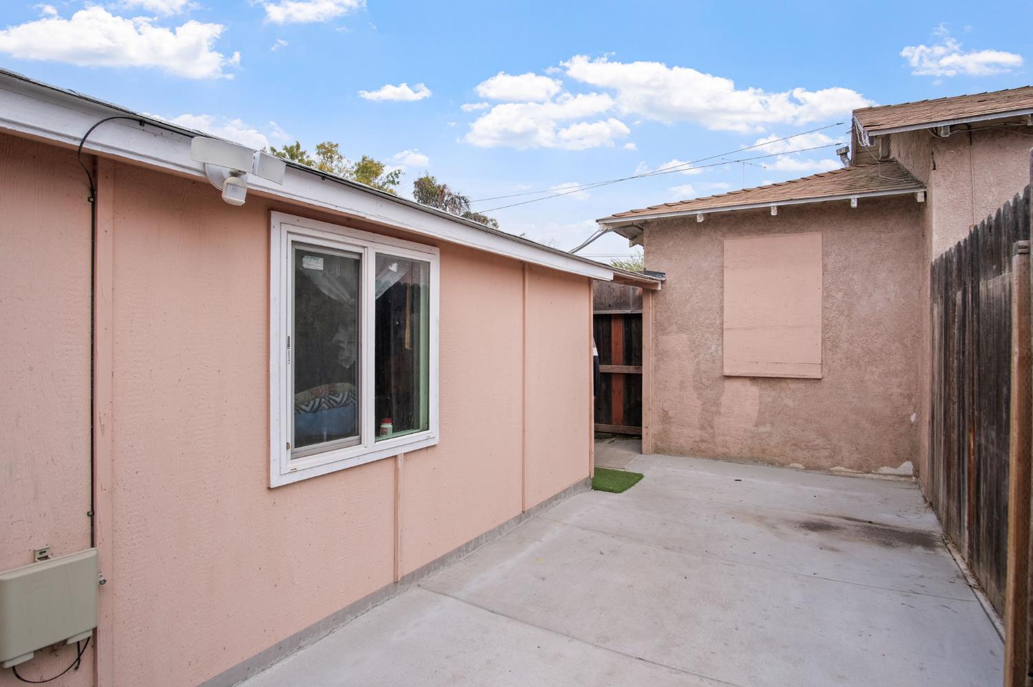 1225 Eugene Avenue Modesto, CA 95351 - Photo 15 of 39 a view of a house with a backyard