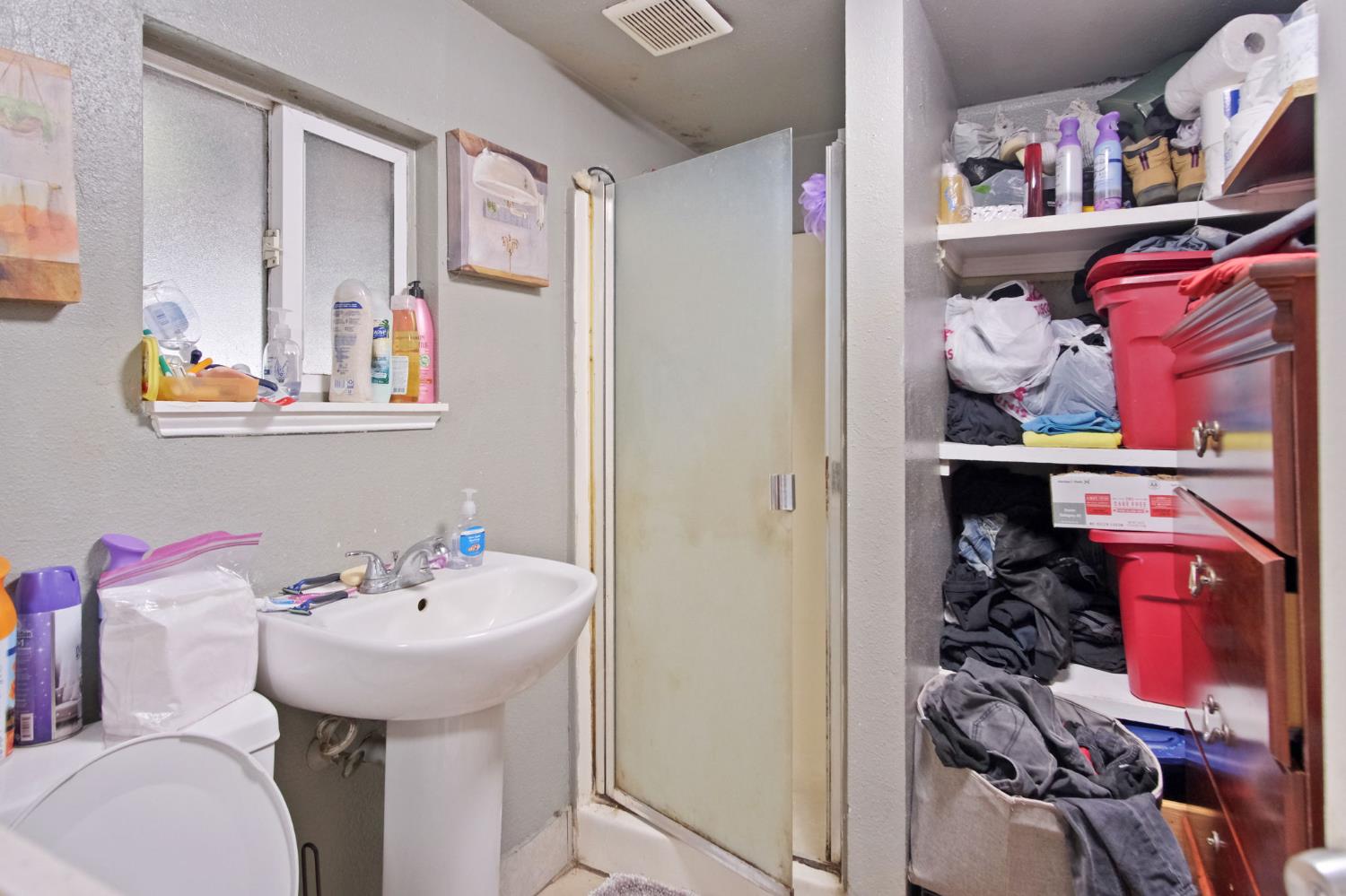 1225 Eugene Avenue Modesto, CA 95351 - Photo 23 of 39 a bathroom with a sink and a mirror